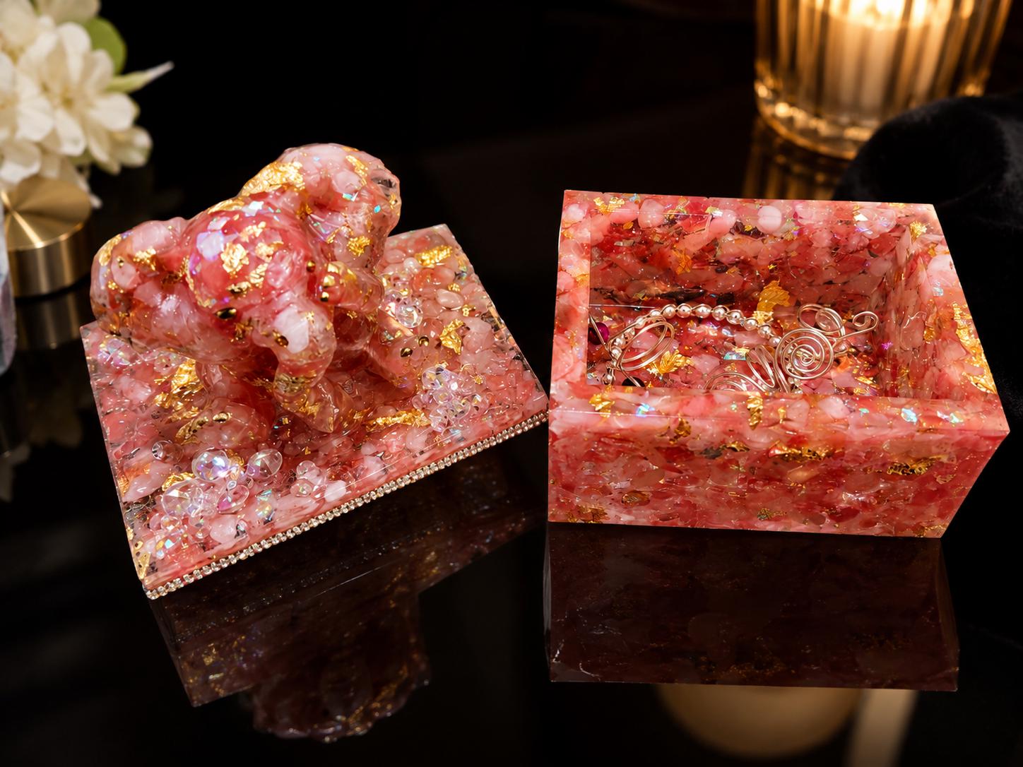 The Watermelon Quartz Elephant box, a golden sculpted elephant seated on a lid of pink quartz and gold leaf.